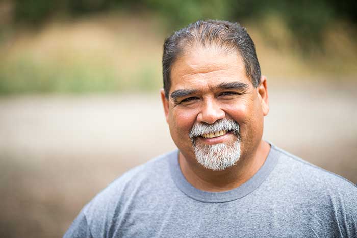 Man happy after getting custom dentures designed for perfect fit and comfort in Laurel, MD