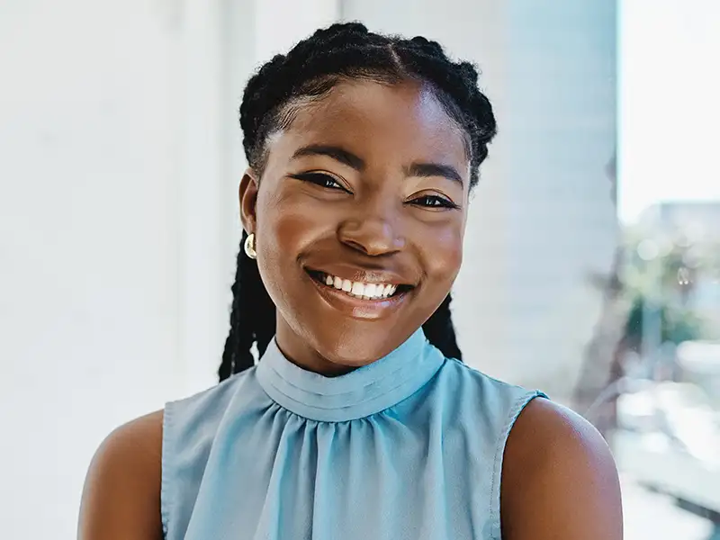 young woman smiling in office