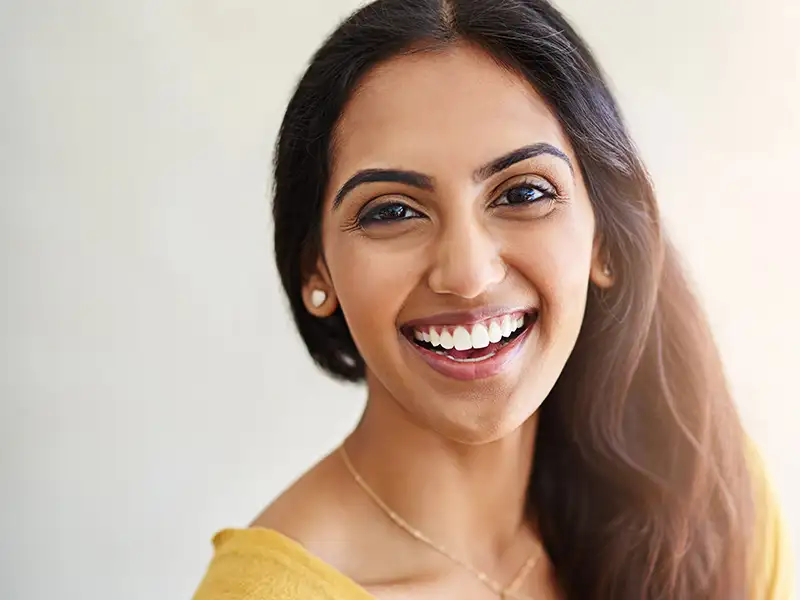 young woman smiling indoors