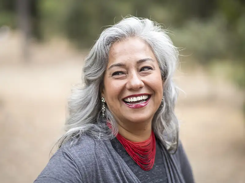mature woman smiling outdoors