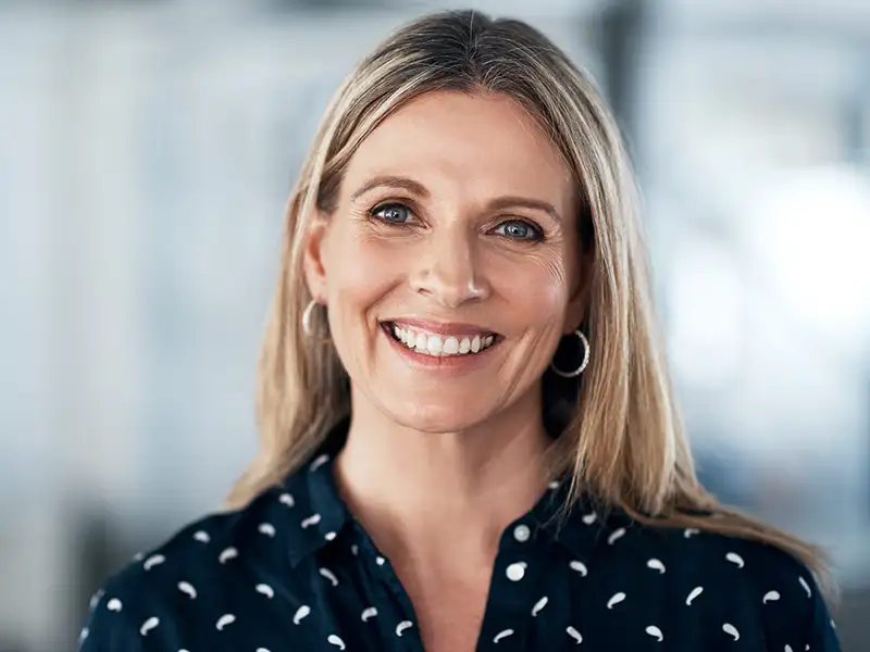 adult woman smiling indoors