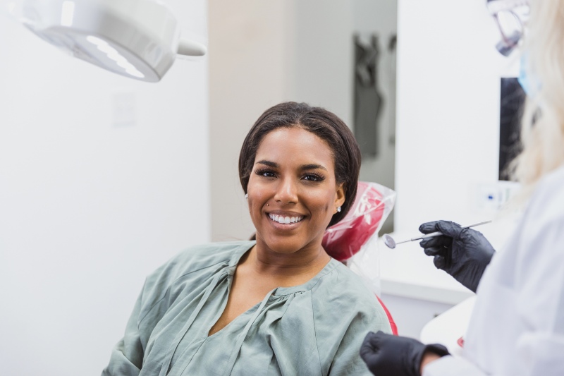 adult woman smiling in the chair at the dentist