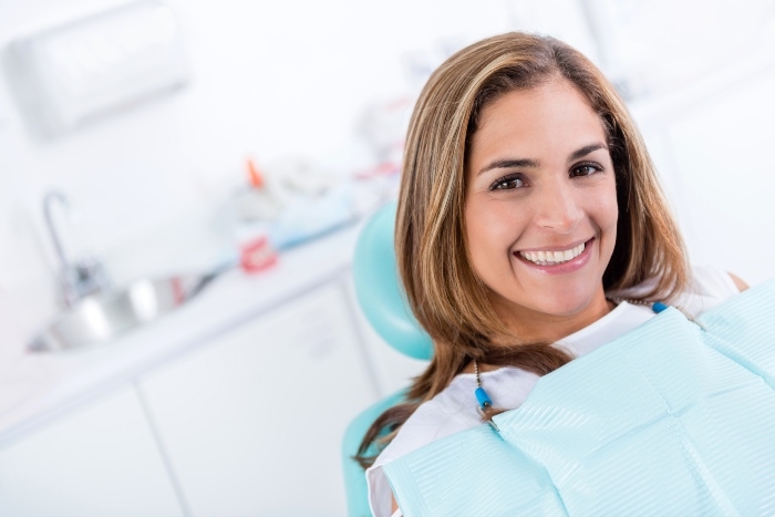 happy woman at the dentist smiling