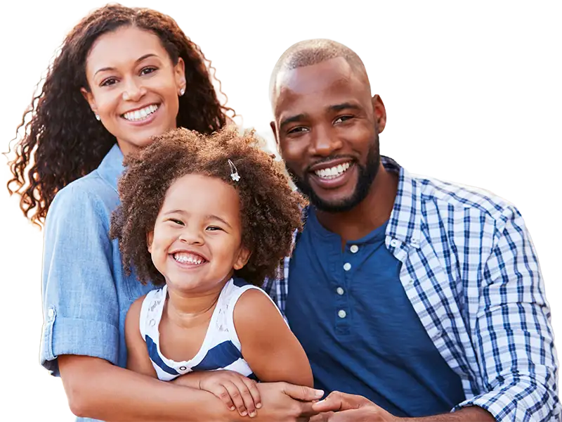 mother and father smiling with young daughter